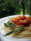 Spaghetti with shrimp and arugula